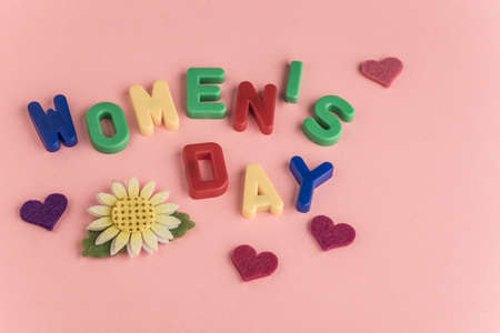 women's day greeting template on pink background with copy spaceの写真素材