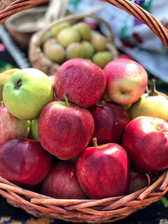Some fresh ripe red apples in a basketの写真素材