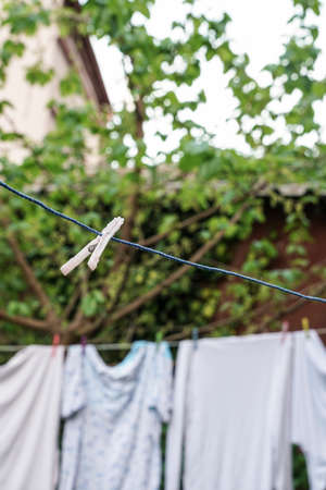 hanged clothes at garden in order to dryの写真素材