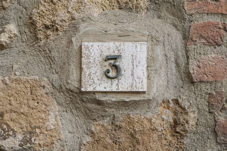 number three on a wall with copy spaceの写真素材