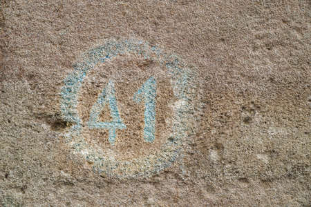 number forty one on a wall as a backgroundの写真素材