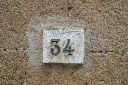 number thirty four on a wall with copy spaceの写真素材