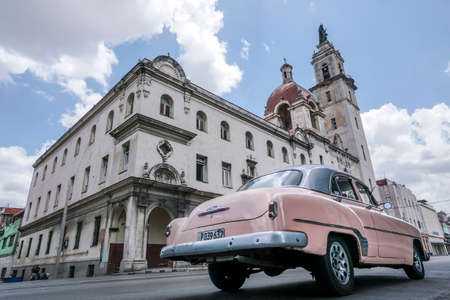 Back of American classic pink car and buildings in Havana, Cuba.のeditorial素材