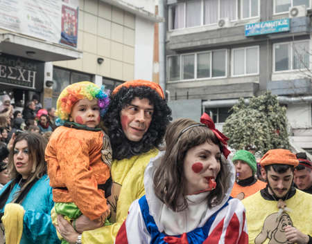 A family in colorful costumes during the annual Carnival Parade in Xanthi, Greece.のeditorial素材