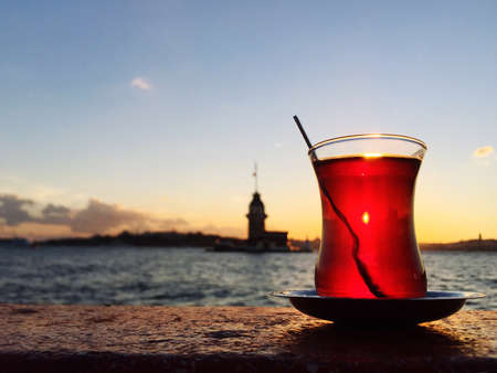 A glass of Turkish tea against maiden's tower in Istanbul, Turkeyの写真素材