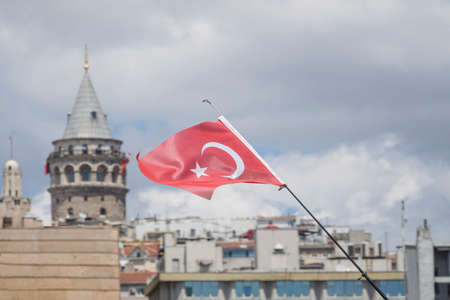 Turkish flag against Galata Tower that is one of landmarks in Istanbul, Turkeyのeditorial素材