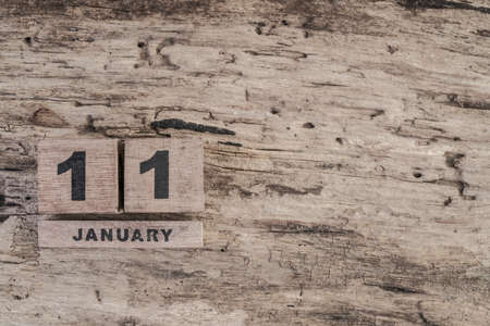 Cube calendar for january on wooden background with copy spaceの写真素材