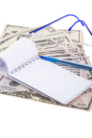 a blank notebook on American dollars with copy spaceの写真素材