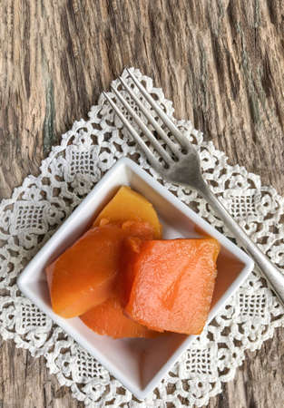 pumpkin dessert plate on a wooden table with copy spaceの写真素材