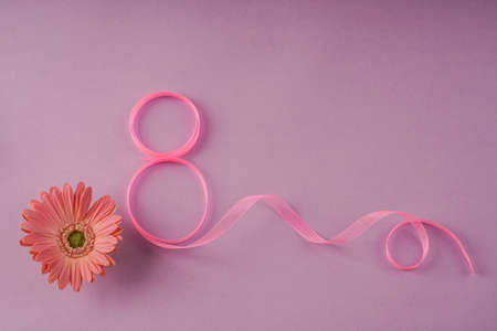 women day template with daisy flower and eight made by ribbon on purpleの写真素材