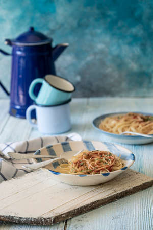 Spaghetti pasta on a wooden table with copy spaceの写真素材