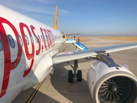 Hatay, Turkey - May 26, 2019; People getting on the plane of Pegasus airlines in Hatay, Turkey.のeditorial素材