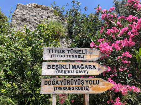 Entrance sign of Titus tunnel and cave in Hatay city of Turkey in Turkish with English translationのeditorial素材