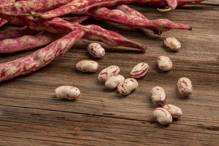 pile fresh kidney beans on a wooden table