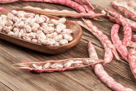 pile fresh kidney beans on a wooden table