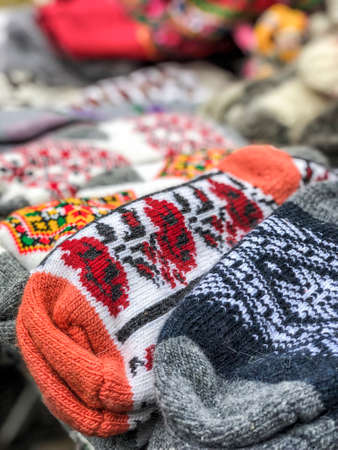 pile of knitted woven socks at a local market