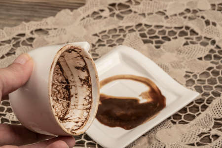 A hand holding coffee cupの写真素材