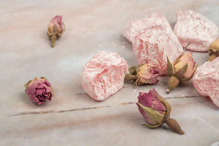 Turkish delights and edible roses on a table