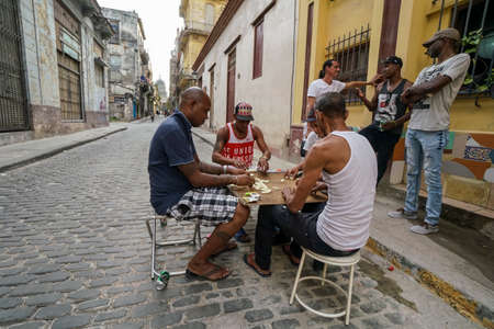 Havana, Cuba - May 01, 2017; Cuban men playing game of dominoes that is very popular in all Cuba.のeditorial素材