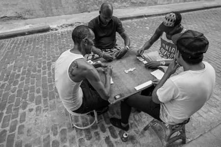 Havana, Cuba - May 01, 2017; Cuban men playing game of dominoes that is very popular in all Cuba. Black and whiteのeditorial素材