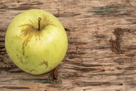 natural and healthy green apple on a wooden tableの写真素材