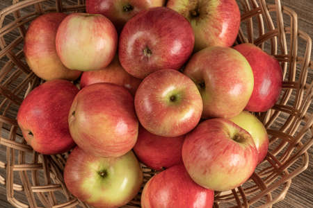 closeup of organic ripe apples in a basket