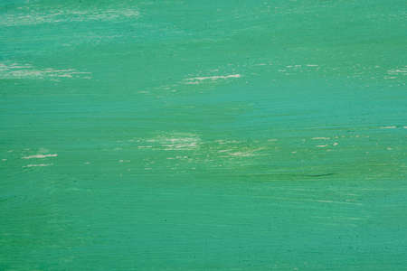 Background of a painted grungy green concrete wall