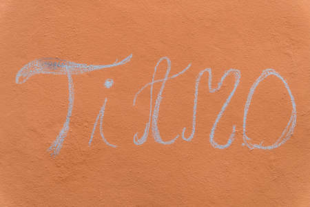 I love you in Italian. Ti amo written on a wall with chalk.