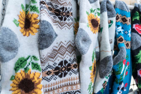 handmade, knitted colorful woven socks as a background