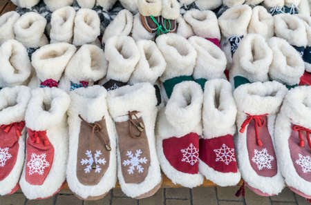 colorful home shoes on shelf at a marketの写真素材