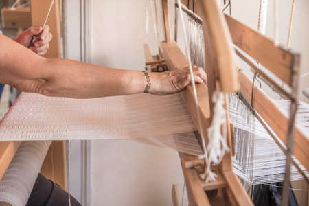 hand weaving textile with a handloom