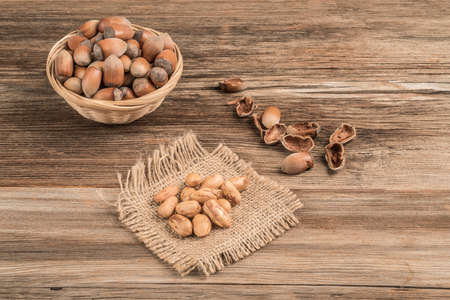 closeup fresh hazelnuts on a wooden table with copy space