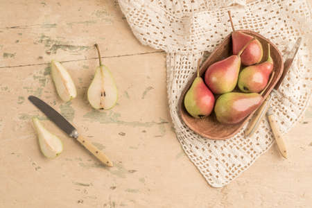 closeup fresh and ripe pears on a wooden tableの写真素材