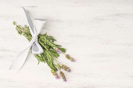 Levander flower bouquet on a wooden table with copy spaceの写真素材