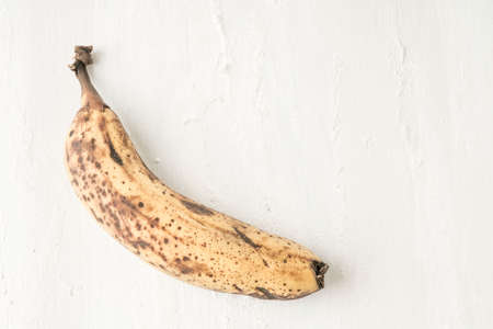 a ripe banana on white background with copy spaceの写真素材