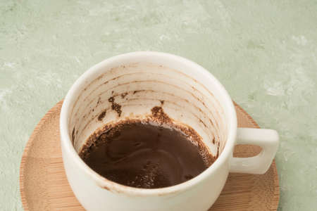 a cup of coffee with grounds for traditional way of fortunetelling from the shapes inの写真素材