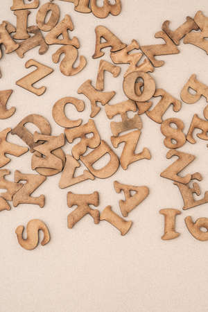 closeup carved wooden alphabets as a background with copy space