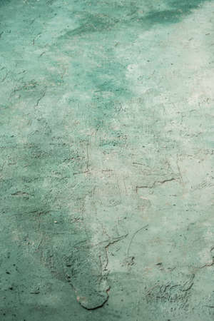 green and white painted grungy rough stucco wall background