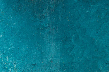 grungy stucco wall background paited blue with white patternsの写真素材