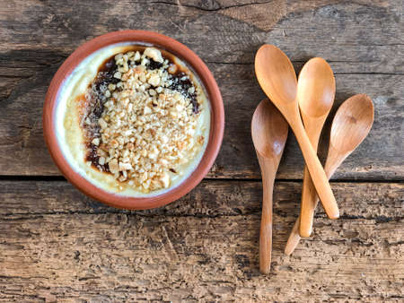 bowl of baked rice pudding that is a traditional Turkish dessert on a wooden table
