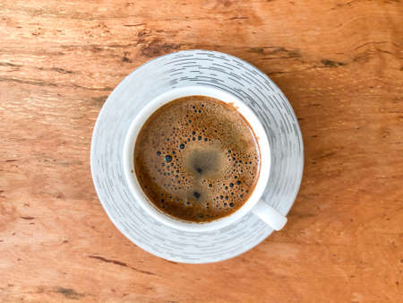 closeup cup of turkish coffee on a wooden tableの写真素材