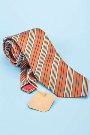 Silk tie with blank label on blue as a fathers day giftの写真素材