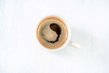 white cup of turkish coffee on a wooden table with copy spaceの写真素材