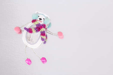snowman shaped Christmas ornament on gray background with copy space for new yearの写真素材