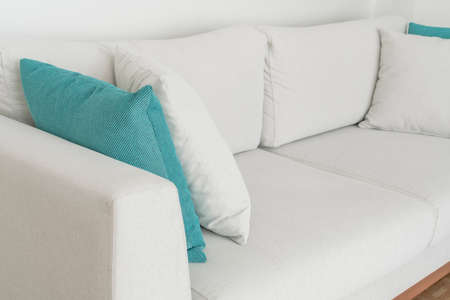 closeup of a gray cushion pillow on a new and comfortable sofa in the living room