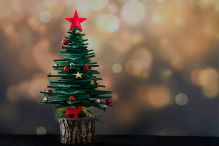 New year, Christmas greeting background with pine tree shaped ornaments over glitter surface with copy space. new year card, Christmas or christmas ornaments.の写真素材