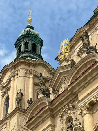 church, st. Nicholas cathedral or church in Prague, Czech Republic or Czechia. religious building exterior. beautiful green dome and gold statues of cathedral. landmark of Prague capital city, Czechiaの写真素材