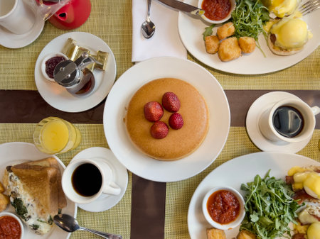 breakfast, top view delicious typical American breakfast table with pancake, egg Benedict, toast and coffee. beautiful food and drink background. brunch table conceptの写真素材
