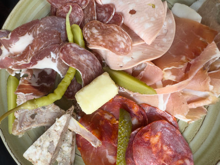food, Appetizer of salami, prosciutto and sliced ham. top view delicious antipasto plate. Sliced...
