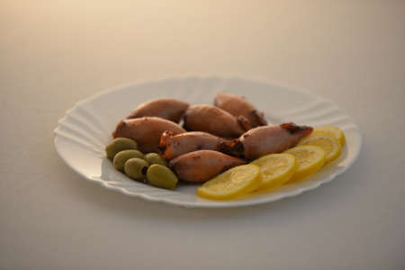 Baked and stuffed squidの写真素材